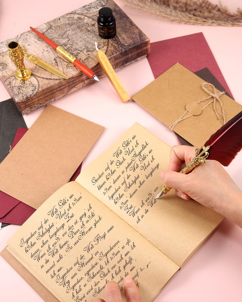 Laad afbeelding in Galerijviewer, Een persoon die met een Verleidelijke kalligrafie set in een vintage-stijl dagboek schrijft, omgeven door benodigdheden voor beginners kalligrafie.
